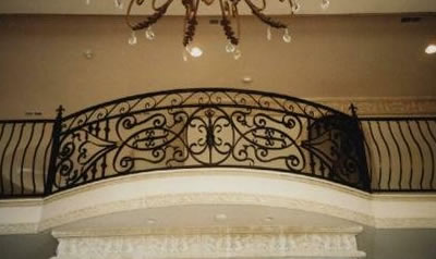 curved balcony railing made from wrought iron