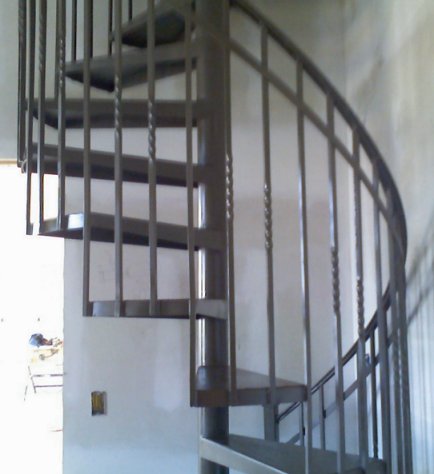 ornamental iron spiral stairway detail view