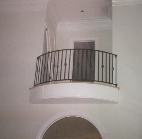 curved wrought iron balcony railing