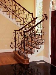 wrought iron railing with wood handrail