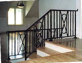 wrought iron railing with bronze rosettes