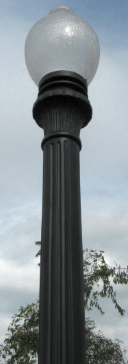 detail photo of river oak street lamp top of shaft with ballast box and globe