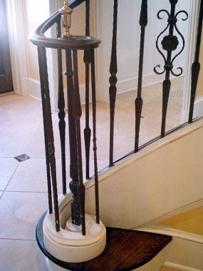 wrought iron lateral scroll on a curved railing